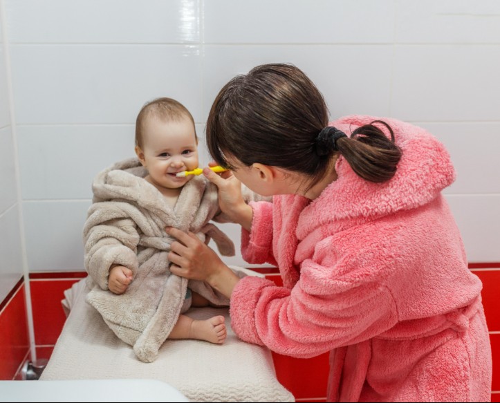 Indian mother breastfeeding newborn baby at home