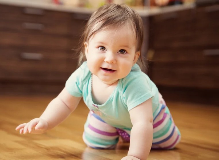 Indian mother breastfeeding newborn baby at home